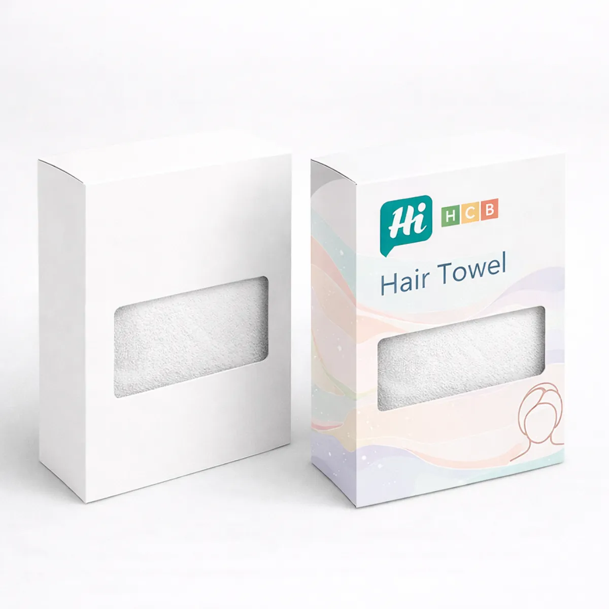 Two upright white boxes with rectangular cut-out windows showing the texture of a white hair towel-